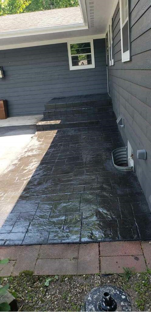 Colored stamped patio resembling stone pattern at Nisswa home